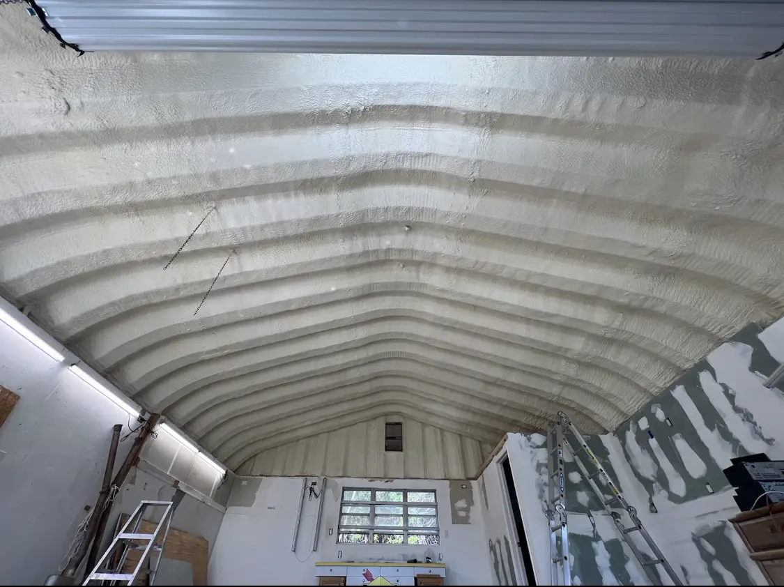 Spray polyurethane foam applied to the underside of a metal roof deck in Chino